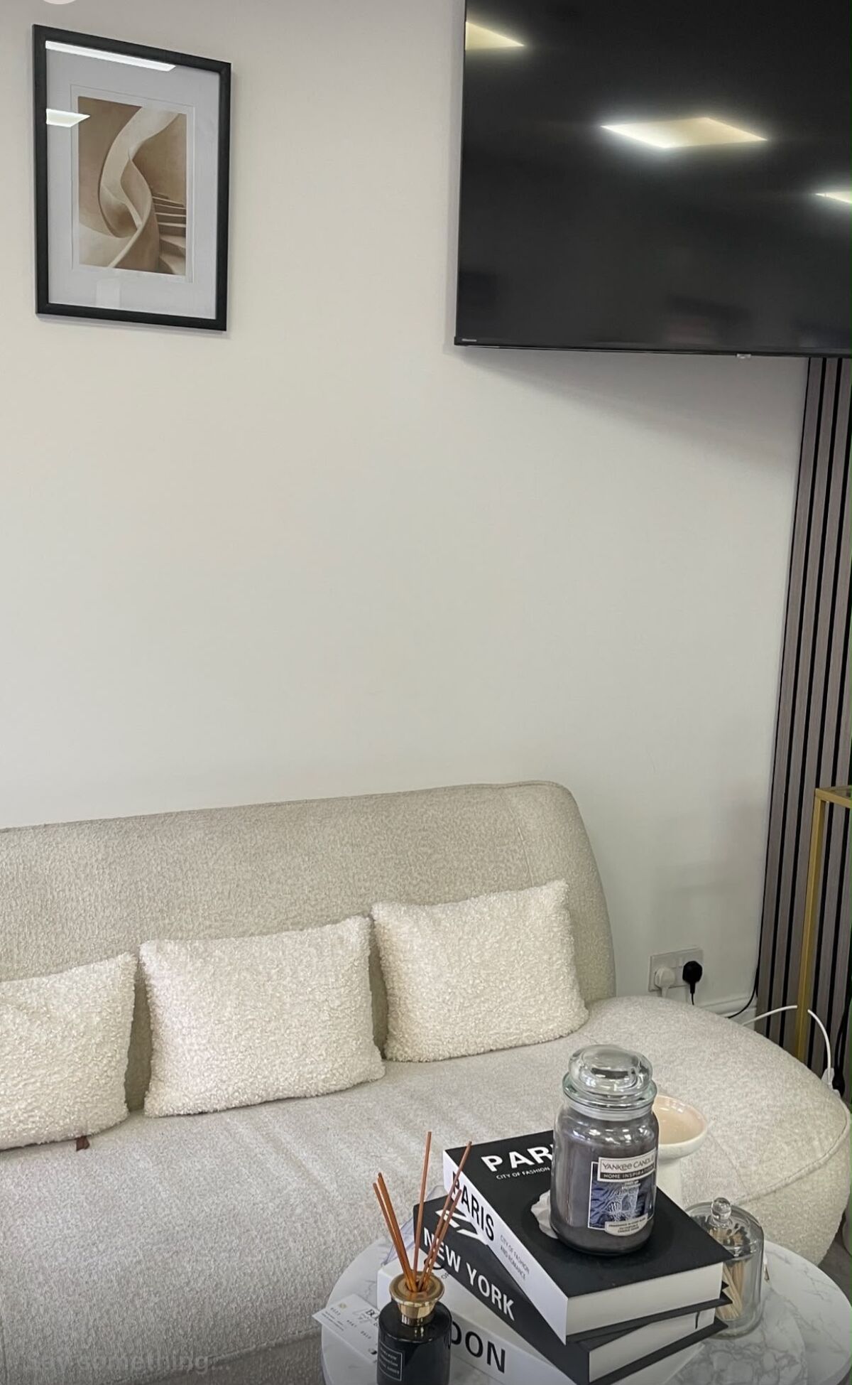 The calm neutral-toned waiting area inside Ombretta Clinic in Salford